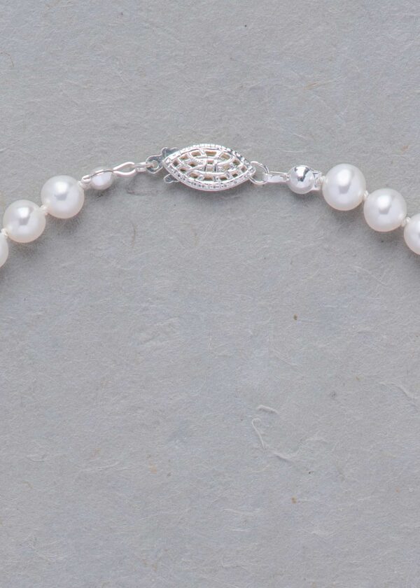 Classic Knotted Pearl Necklace in Silk - Image 7